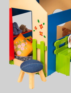a toy house with a stool and stuffed animals