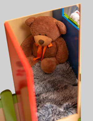 a teddy bear in a toy box