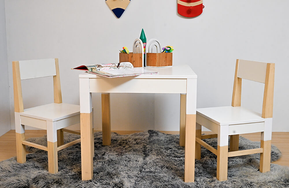 wood table and chair with white color combination ,table holding book and accessories.