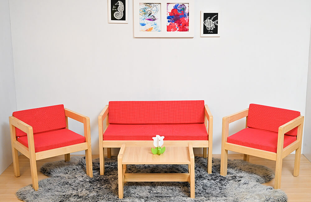 wood furniture in red cushions with table holding decorations piece of flower.