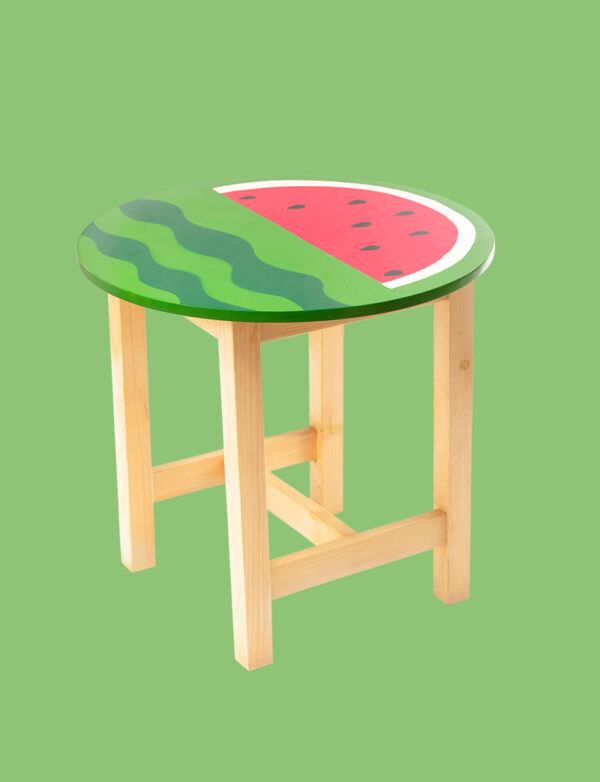 a small wooden stool with a watermelon painted on it