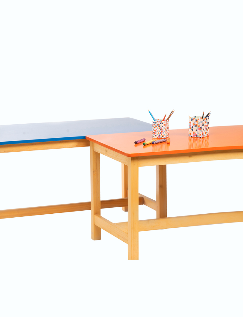 a table with a couple of colored pencils