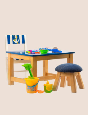 a wooden table and chairs with some toys
