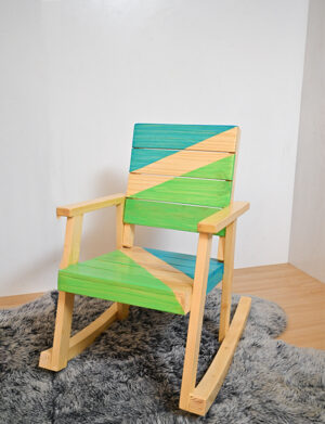 a blue and green rocking chair on a rug