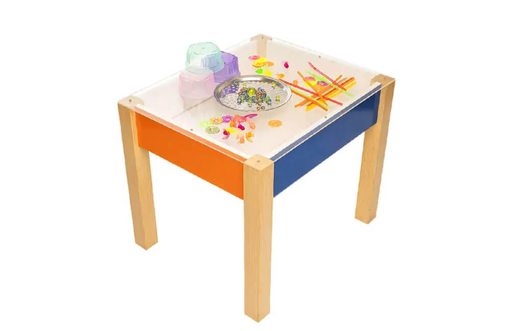 stylish functional desk with bright blue and pink surface. holding some accessories'.